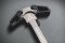 Tactical charging handle for AR15 rifles. From rapid palm “blading” or finger thumb charges of the weapon, the motion is fluid & fast from either strong or support side.
